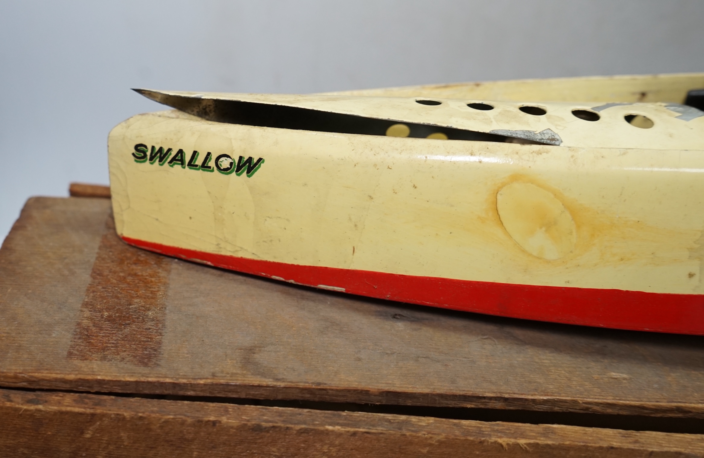 A 1930s wooden boxed Bowman Models live steam speedboat; ‘Swallow’, of wood and tinplate construction, hull 49cm long. Condition - fair.